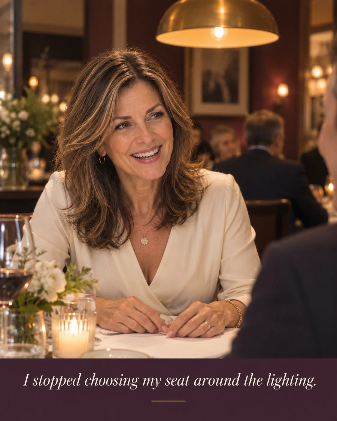 Woman enjoying dinner without choosing her seat based on overhead lighting